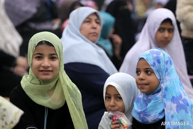 Palestinians attend a special prayer on the first day of Eid al-Adha in Gaza city on Nov.16,2010. Muslims around the world celebrate Eid al-Adha to mark the end of the haj by slaughtering sheep, goats, cows and camels to...