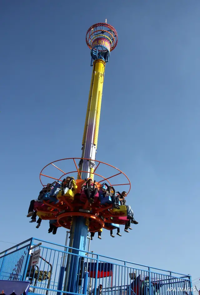 Palestinians enjoy a ride in an amusement park in the West Bank city of Ramallah on the second day of Eid al-Adha,on, November, 17, 2010. as Muslims worldwide commemorate Eid al-Adha, or the Feast of the Sacrifice, marki...
