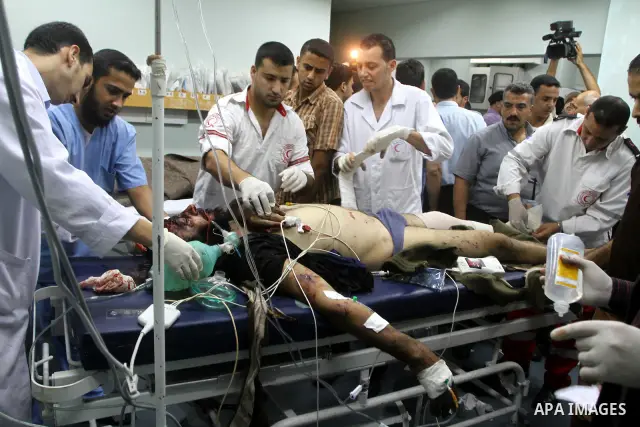 A wounded Palestinian man receives treatment at Shifa Hospital following an explosion in Gaza City, Wednesday, Nov. 17, 2010. Hamas officials say one person has been killed and four others wounded in a car explosion in t...
