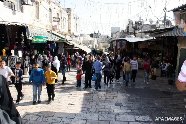 Palestinians celebrate in Jerusalem's old city on the second day of Eid al-Adha,on November, 17, 2010. as Muslims worldwide commemorate Eid al-Adha, or the Feast of the Sacrifice, marking the end of the hajj and commemor...