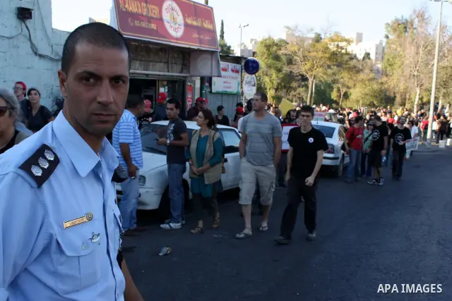 Left-wing Israelis and Palestinians protest against the Jewish takeover of Arab properties in the Sheikh Jarrah neighborhood of East Jerusalem on 19 November 2010. Several hundred people turned out today to protest the c...