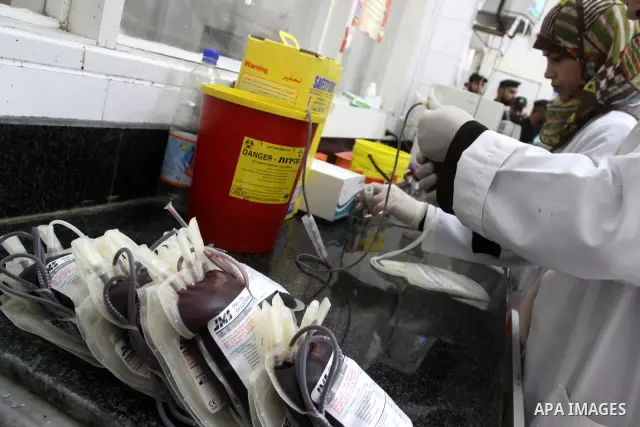 A member of the Palestinian security in Gaza strip , donates blood during a police campaign to donate blood at Al-Shifa hospital , in Gaza City on Nov. 21,2010 . Photo by Mohammed Asad