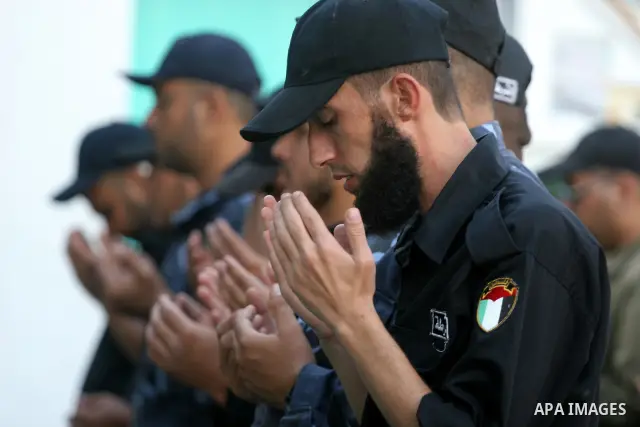 Palestinian security forces in Gaza Strip , perform a special prayer for the rain , in Gaza City on Nov. 22,2010 . Photo by Mohammed Asad