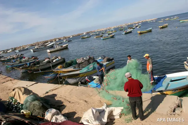 Palestinian fishermen work inside the port of Gaza City, Tuesday on Nov. 23, 2010 . Islamic Relief in coordination with the Ministry of Transport and Communications opened a new stores for fishermen in the port of Gaza C...