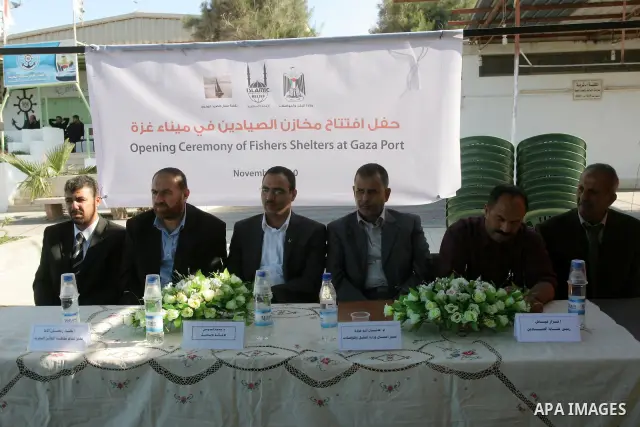 Palestinian attend the opening of the new stores for fishermen in the port of Gaza City, Tuesday on Nov. 23, 2010 . Islamic Relief in coordination with the Ministry of Transport and Communications opened a new stores for...