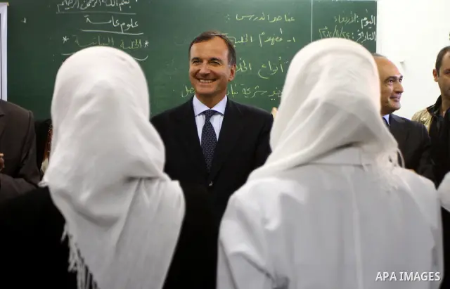 Italian Foreign Minister Franco Frattini, is accompanied by members of his delegation and security personnel as he visits a United Nations girl's school in Beit Lahia, northern Gaza Strip, on 24 November 2010. Photo by A...