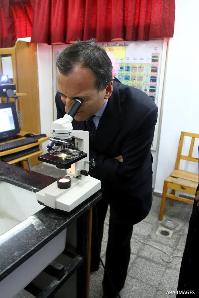 Italian Foreign Minister Franco Frattini, is accompanied by members of his delegation and security personnel as he visits a United Nations girl's school in Beit Lahia, northern Gaza Strip, on 24 November 2010. Photo by A...
