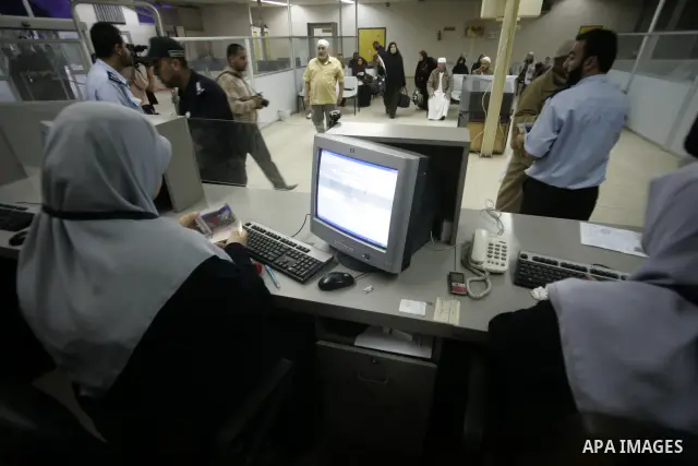 Palestinian pilgrims wait at a hall after they cross the Rafah border crossing into Gaza Strip, in the southern Gaza strip town of Rafah on Nov. 24,2010 . Hundreds of Palestinian pilgrims will cross into Gaza Strip on th...