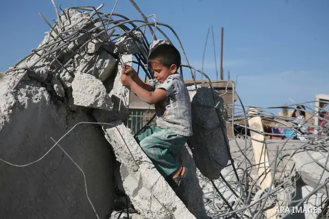 A Palestinian child is seen near the rubble of their family house after it was destroyed by Israeli army tractors early on November 25, 2010 in the West Bank village of Yatta near Hebron. The house was located in the so-...