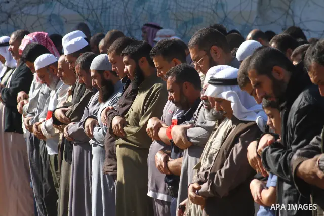 Palestinians perform a special prayer for the rain , in Gaza City on Nov. 27,2010 . Photo by Ashraf Amra