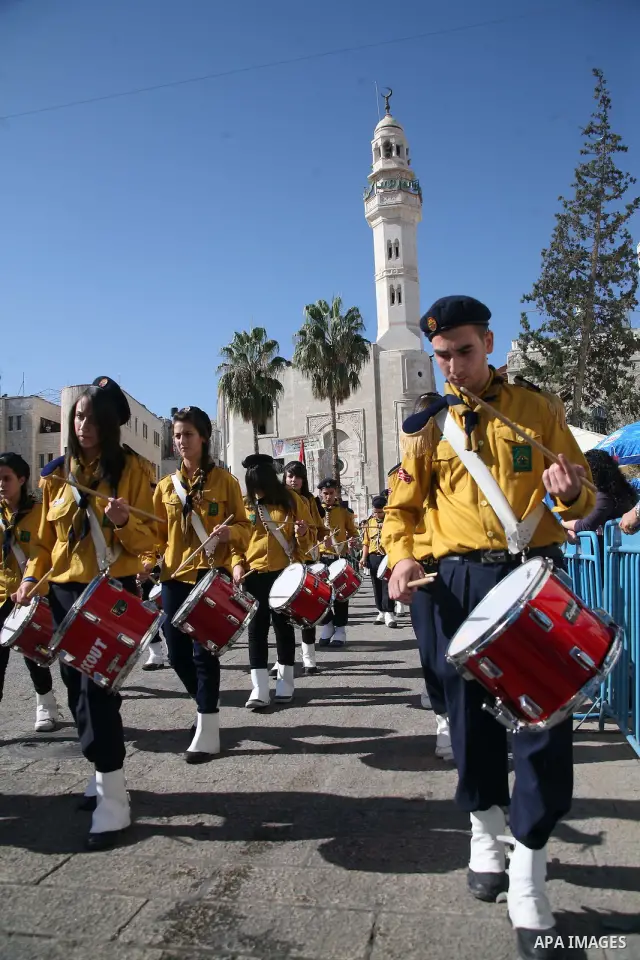 Palestinian take part during the Christian Custodian of the Holy Land, Pierbattista Pizzaballa of the Franciscan order, visits the Church of St. Catherine in the West Bank town of Bethlehem on November 27, 2010. The visi...