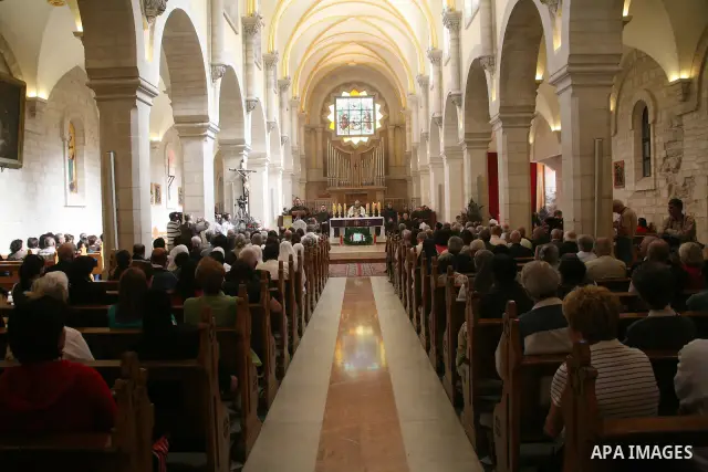 The Christian Custodian of the Holy Land, Pierbattista Pizzaballa of the Franciscan order, visits the Church of St. Catherine in the West Bank town of Bethlehem on November 27, 2010. The visit marked the beginning of the...