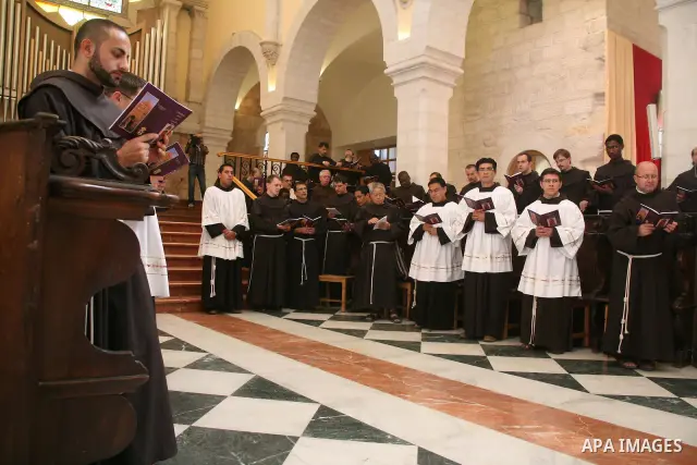 The Christian Custodian of the Holy Land, Pierbattista Pizzaballa of the Franciscan order, visits the Church of St. Catherine in the West Bank town of Bethlehem on November 27, 2010. The visit marked the beginning of the...