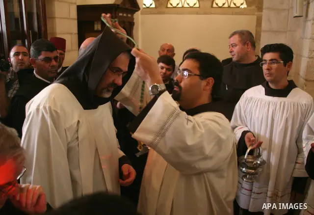 The Christian Custodian of the Holy Land, Pierbattista Pizzaballa of the Franciscan order, visits the Church of St. Catherine in the West Bank town of Bethlehem on November 27, 2010. The visit marked the beginning of the...