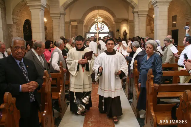 The Christian Custodian of the Holy Land, Pierbattista Pizzaballa of the Franciscan order, visits the Church of St. Catherine in the West Bank town of Bethlehem on November 27, 2010. The visit marked the beginning of the...
