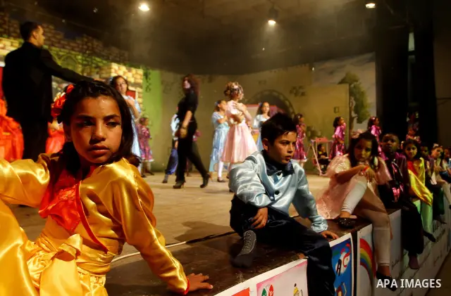 Palestinian children perform in a play marking the 21st anniversary of the signing of the Convention on the Rights of the Child (CRC) during a celebration organized by the United Nations Children's Fund (UNICEF), in Gaza...