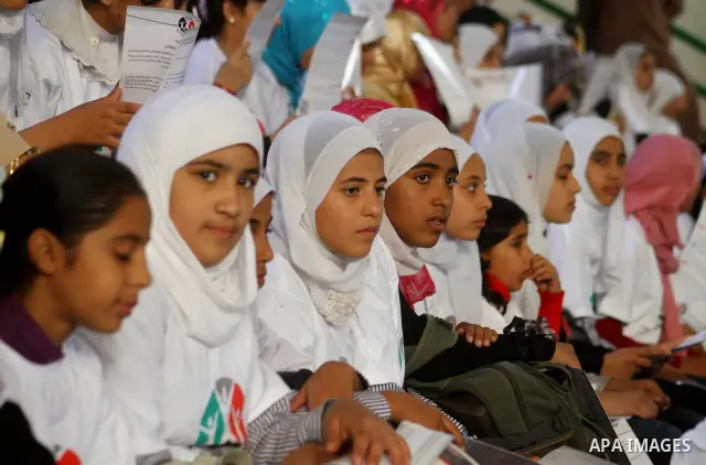 Palestinian children attend a festival marking the 21st anniversary of the signing of the Convention on the Rights of the Child (CRC) , organized by the United Nations Children's Fund (UNICEF), in Gaza City on Nov. 28, 2...