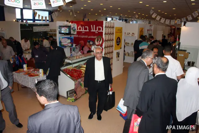 Palestinians display their products in the exhibition "National Industries 2010" in the West Bank city of Ramallah, on Nov. 28, 2010. Photo by Issam Rimawi
