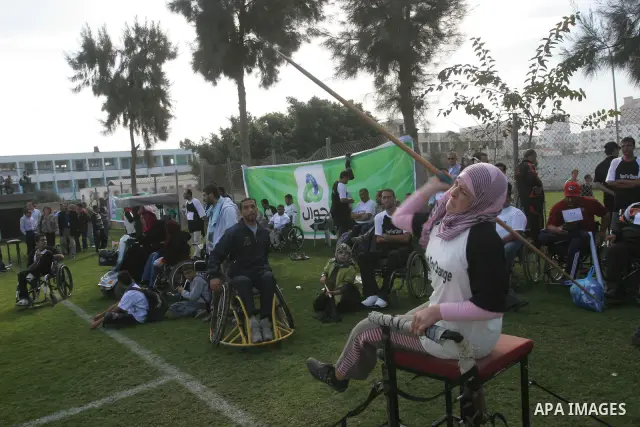Disabled Palestinians participate in an athletics championship for disabled , in Gaza city on Nov. 29,2010. Photo by Mohammed Asad