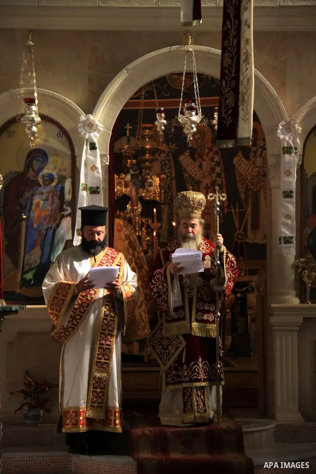 Orthodox Christians attend prayers in the Church of Jacob's a deep well that has been associated in religious tradition with Biblical Jacob for roughly two thousand year in West Bank city of Nablus, Monday, Nov. 29, 2010...