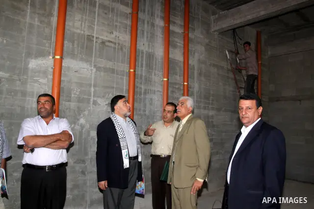 Members of the Islamic Conference Organization attend the opening ceremony of reconstruction for 400 house which were destroyed during the Israeli offensive on Gaza Strip in the northern Gaza Strip, on Dec. 1,2010. Photo...
