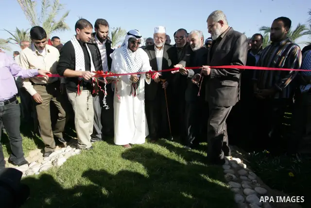 Palestinian Minister of Agriculture, Mohammed al-Agha attend the opening ceremony of a new palmtrees farm with members of the Islamic Conference Organization delegation in the former Israeli settlements near the southern...
