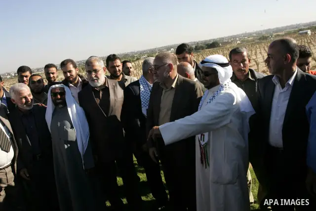 Palestinian Minister of Agriculture, Mohammed al-Agha attend the opening ceremony of a new palmtrees farm with members of the Islamic Conference Organization delegation in the former Israeli settlements near the southern...