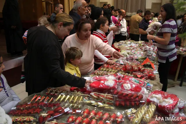 Palestinian Christians buy products especially for the Christian Christmas day at a market in the West Bank city of Ramallah on Dec 2, 2010. Photo by Issam Rimawi