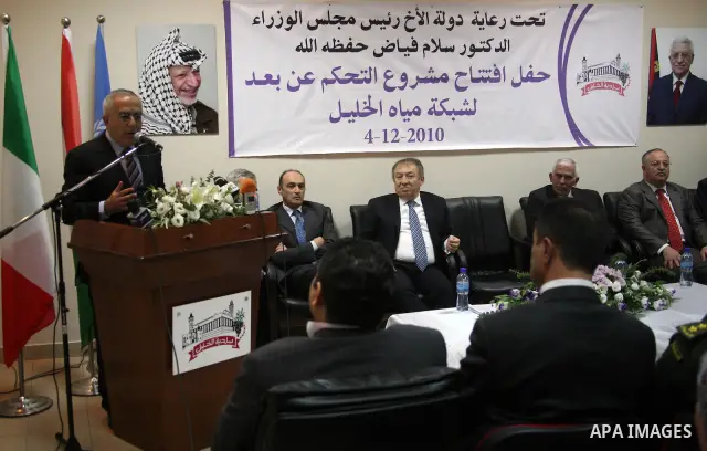 Palestinian Prime Minister Salam Fayyad attends the opening ceremony of the distance control project for the water nets in the West Bank city of Hebron on Dec. 4,2010. Photo by Najeh Hashlamoun