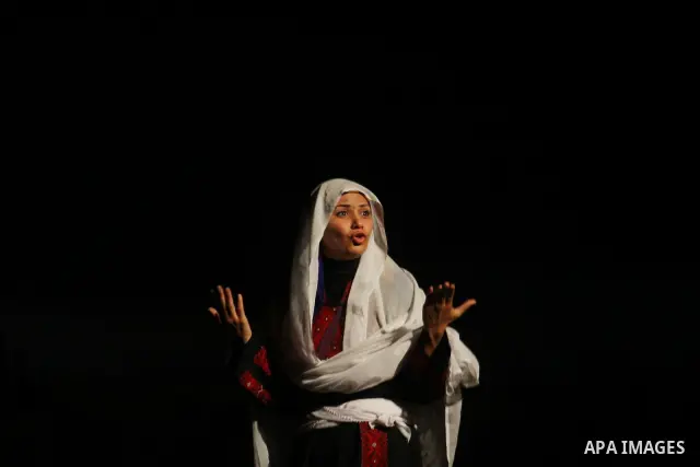 Palestinian actors and actresses perform at the Shawwa Theatre the play " 63 not the last time " in Gaza City on Dec. 4, 2010. The play events speak about the Palestinian catastrophe and the Palestinians immigration from...