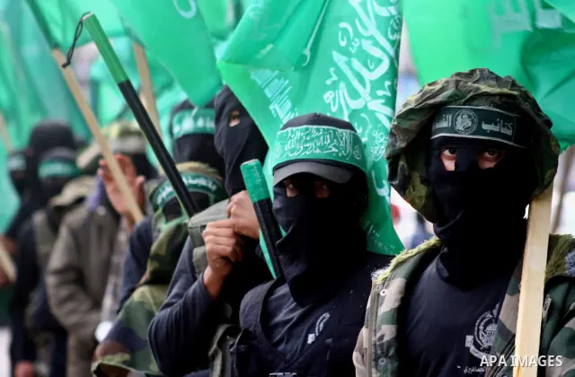Masked Hamas members attend a rally in the Nusseirat refugee camp in the central of Gaza Strip on Dec 5, 2010 in the preparation to celebrate in the anniversary of Hamas movement foundation. Photo by Ashraf Amra