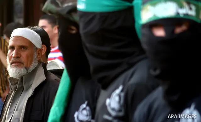 Masked Hamas members attend a rally in the Nusseirat refugee camp in the central of Gaza Strip on Dec 5, 2010 in the preparation to celebrate in the anniversary of Hamas movement foundation. Photo by Ashraf Amra