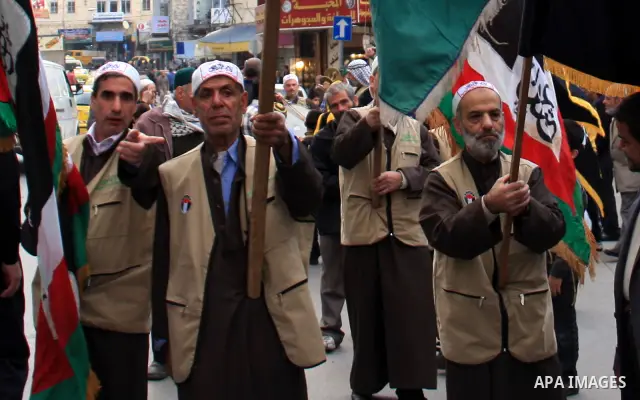 Palestinian Muslims celebrate during a ceremony to mark the anniversary of prophet Mohammad immigration in the West Bank city of Nablus, Tuesday, Dec. 7, 2010. Photo by Wagdi Eshtayah