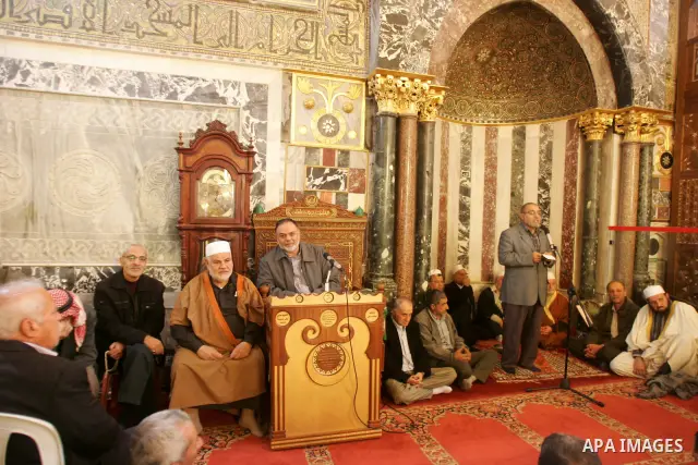 Palestinian Muslim celebrate during a ceremony to mark the anniversary of prophet Mohammad immigration inside Al Aqsa mosque in the Al Aqsa Mosque compound, also known to Jews as the Temple Mount, in Jerusalem's old city...