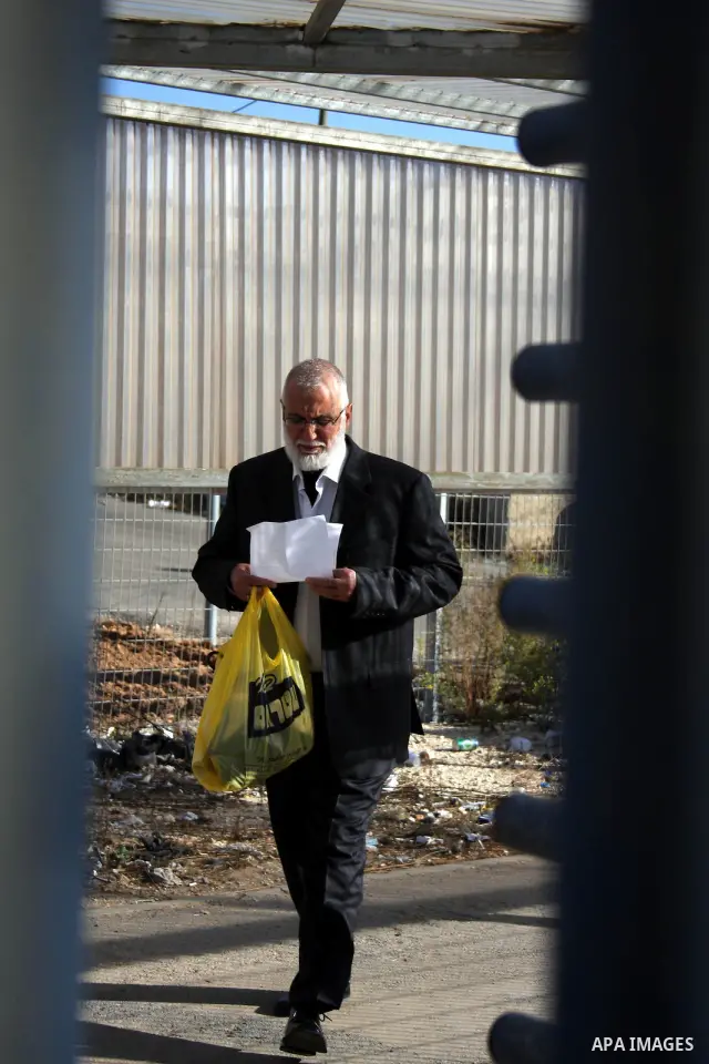 Mohammed Abu Teir, a deputy in the Palestinian Legislative Council by the Department of Jerusalem walks after his release from Israeli jails and his return to the West Bank "Ofer" military checkpoint in the West Bank cit...