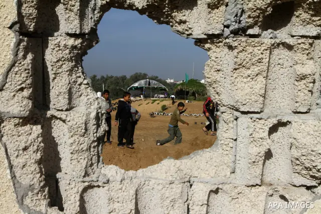 Palestinian boys stand near the rubble of Hamas facility after it was damaged by Israeli air force, in Gaza City on December 9, 2010 along with 3 other sites in the territory after Palestinian militants fired several mor...