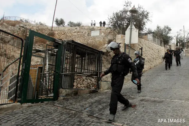 Israeli soldiers take position during the clashes with Palestinian youths in the east Jerusalem neighborhood of Silwan after Friday prayers on Dec. 10, 2010. Photo by Mahfouz Abu Turk