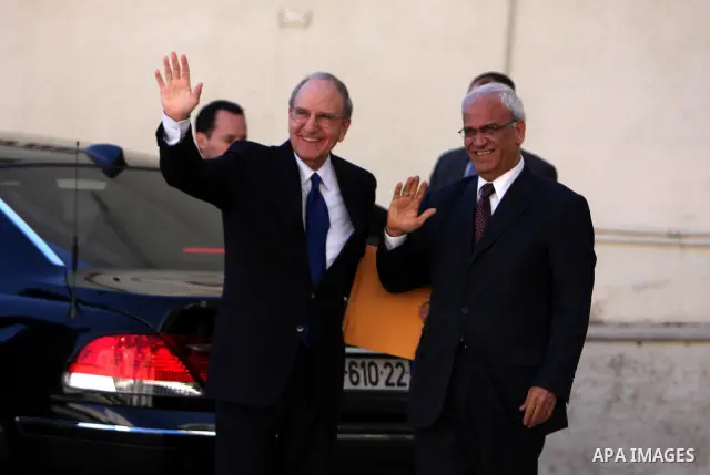 US special envoy to the Middle East, George Mitchell is welcomed by Saeb Erekat, Senior Palestinian negotiator upon his arrival to the West Bank town of Ramallah on December 14,2010. Photo by Issam Rimawi