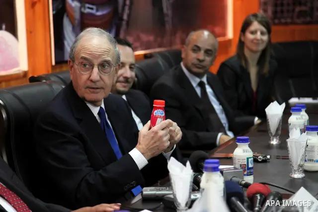 U.S Middle East envoy for peace process, George Mitchell tours the Al-Juneidi dairy products factory in the the West Bank city of Hebron on December 14, 2010. Photo by Najeh Hashlamoun