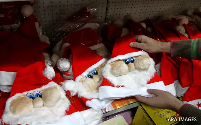 A Palestinian man displays products especially for the Christian Christmas day at his shop in Gaza City on Dec. 18, 2010. Photo by Ashraf Amra