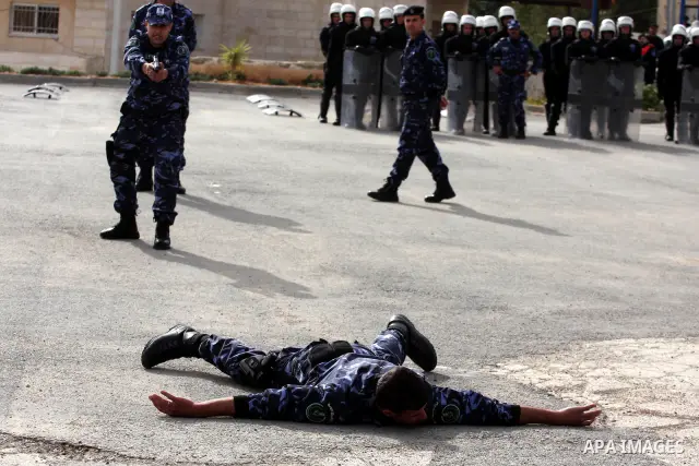 Members of the Palestinian police forces demonstrate their skills during a graduation ceremony in the West Bank city of Ramallah, on December 19, 2010. Photo by Issam Rimawi