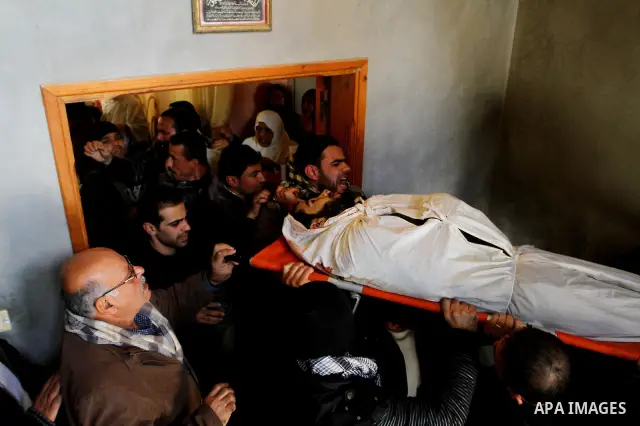 Palestinian mourners carry the body of Mohamed Al Asar, during his funeral in Deir Al Balah, central Gaza Strip, Sunday, Dec. 19, 2010. Al Shraihy and four other Palestinian militants were killed Saturday in an Israeli a...