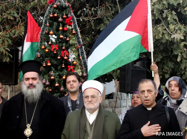 Palestinian Muslims and Christians take part in a rally in front of a disputed house, occupied by Jewish settlers, in east Jerusalem's mainly Arab Sheikh Jarrah district as families who lost their homes in the neighbourh...