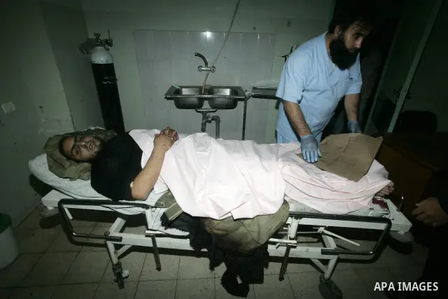 A wounded Palestinian man receives treatment at Nasir hospital in southern Gaza Strip town of Khan Yunis, on December 21, 2010. Israeli warplanes launched morning Several raids strikes against Gaza Strip, wounding two pe...