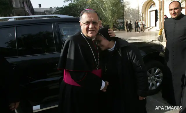 Latin Patriarch of Jerusalem Fouad Twal, left, is greeted at the Deir Al Latin Catholic Church in Gaza City, Wednesday, Dec. 22, 2010. Twal arrived in Gaza on Wednesday to attend a celebration with Palestinians ahead of...