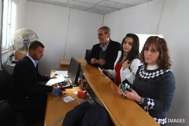 A Christian Palestinian family leaves Gaza to enter Israel through the Erez border crossing between Israel and northern Gaza Strip on Dec. 23,2010. The Israeli army on Thursday allowed some 550 Christian Palestinians to...