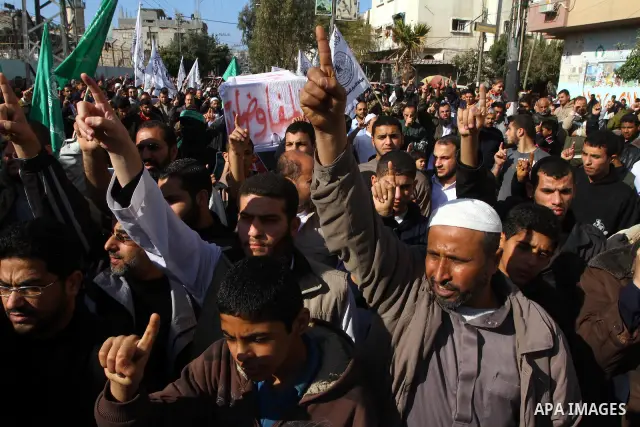 Hamas supporters take part in a protest in Nusseirat refugee camp, central Gaza Strip in the southern Gaza Strip on December 24, 2010, calling for the release of Hamas prisoners from jails in the West Bank controlled by...
