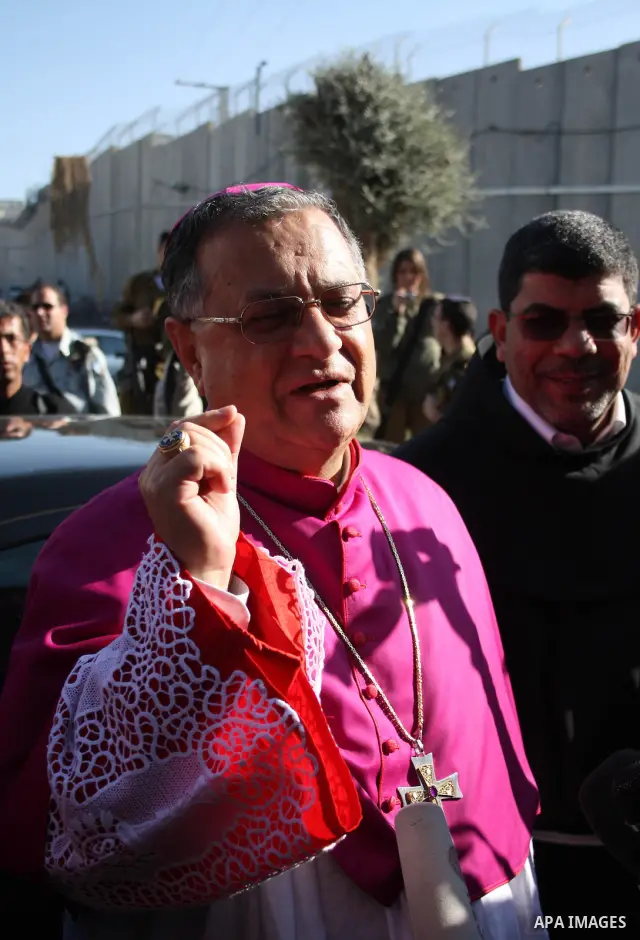 The Latin Patriarch of Jerusalem Fouad Twal arrives to the West Bank city of Bethlehem December 24, 2010. Twal crossed from Jerusalem into Bethlehem through a checkpoint on Thursday to attend an annual Christmas processi...