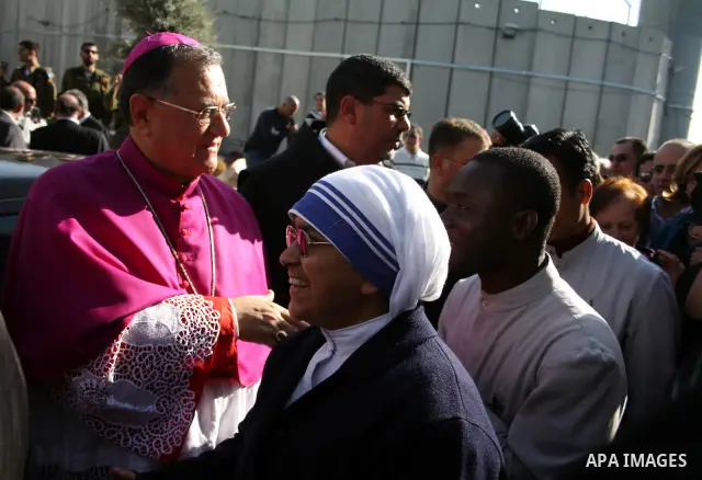 The Latin Patriarch of Jerusalem Fouad Twal arrives to the West Bank city of Bethlehem December 24, 2010. Twal crossed from Jerusalem into Bethlehem through a checkpoint on Thursday to attend an annual Christmas processi...