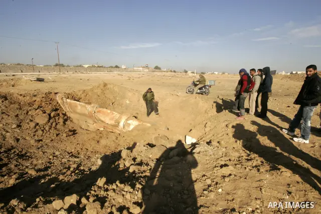 Palestinians inspect the damage to a smuggling tunnel which was targeted during an Israeli air strikes overnight in southern Gaza Strip town of Rafah, on December 25, 2010. Photo by Abed Rahim Khatib